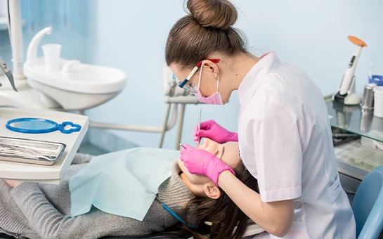 Person Receiving Dental Cleaning Exam